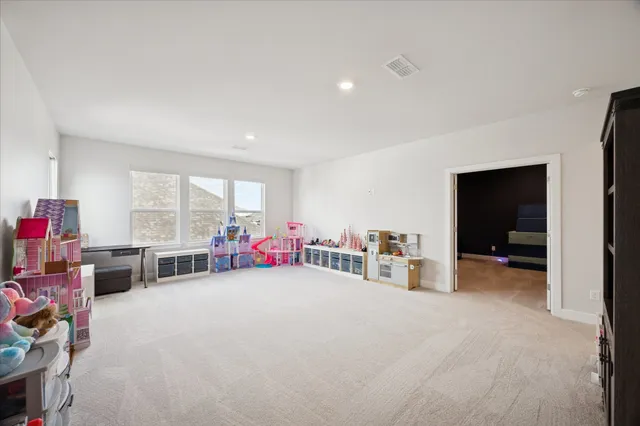 a view of a livingroom with workspace and a window