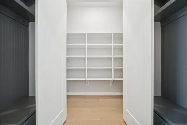 a view of a room with shelf and a closet