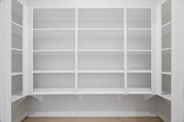 a view of a room with racks on the wall