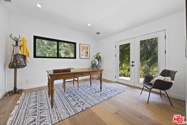 a bathroom with a granite countertop sink a toilet and shower