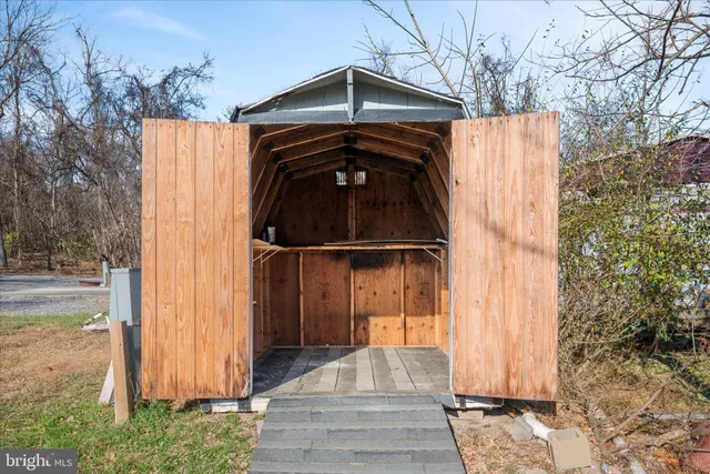 a aerial view of a residential houses with yard