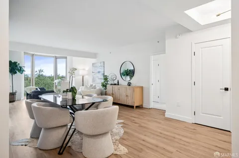 a spacious bedroom with a bed and a large window