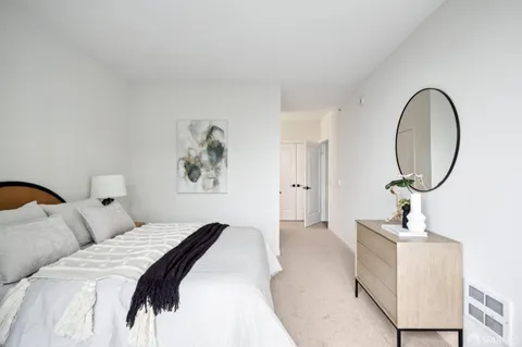 a view of a glass door with a balcony next to a yard