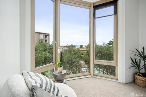 a bedroom with a bed and a table