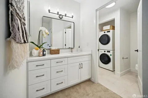 a bathroom with a double vanity sink and a mirror