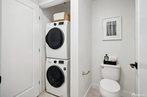 a white bath tub sitting next to a white toilet