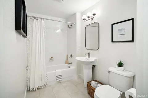 a bedroom with a bed and a desk