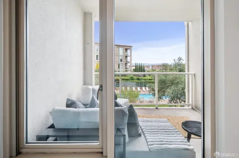 a bedroom with a bed and a table