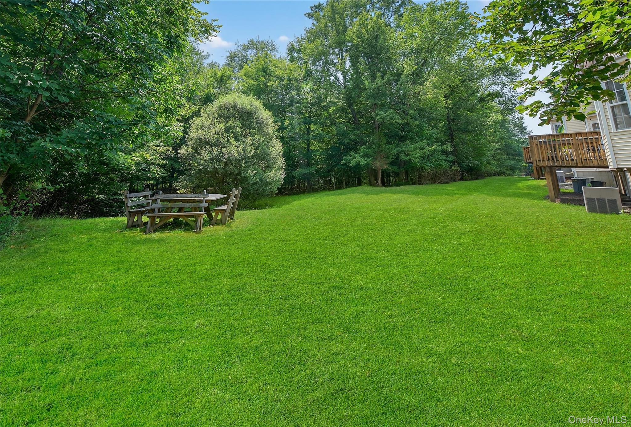 1 Lake Ridge Drive Middletown, NY 10940 - Photo 36 of 44 a view of a backyard with a bench