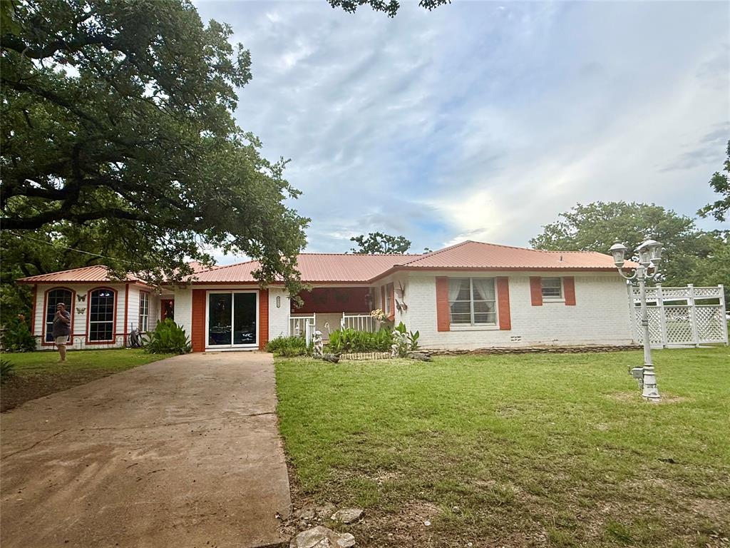4216 Greenwood Road Weatherford, TX 76088 - Photo 2 of 26 Brick home with low maintenance metal roof