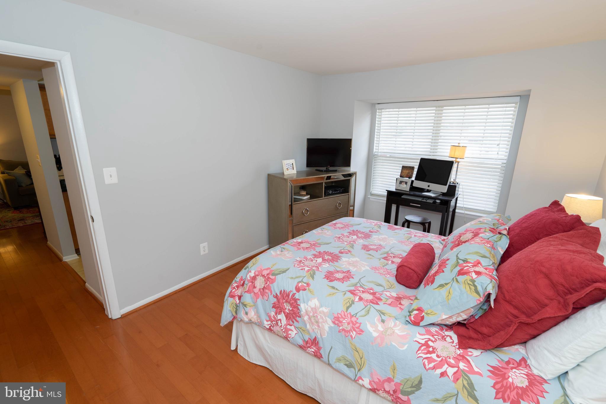 1711 Ascot Way, Unit C Reston, VA 20190 - Photo 12 of 26 Master Bedroom with Hardwood Floors