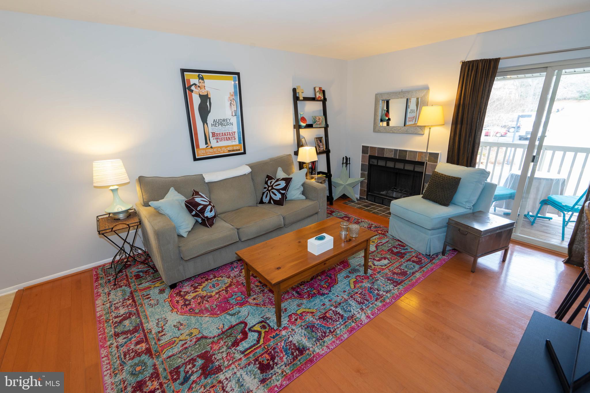 1711 Ascot Way, Unit C Reston, VA 20190 - Photo 3 of 26 Living Room with Sliding Glass Door to Balcony