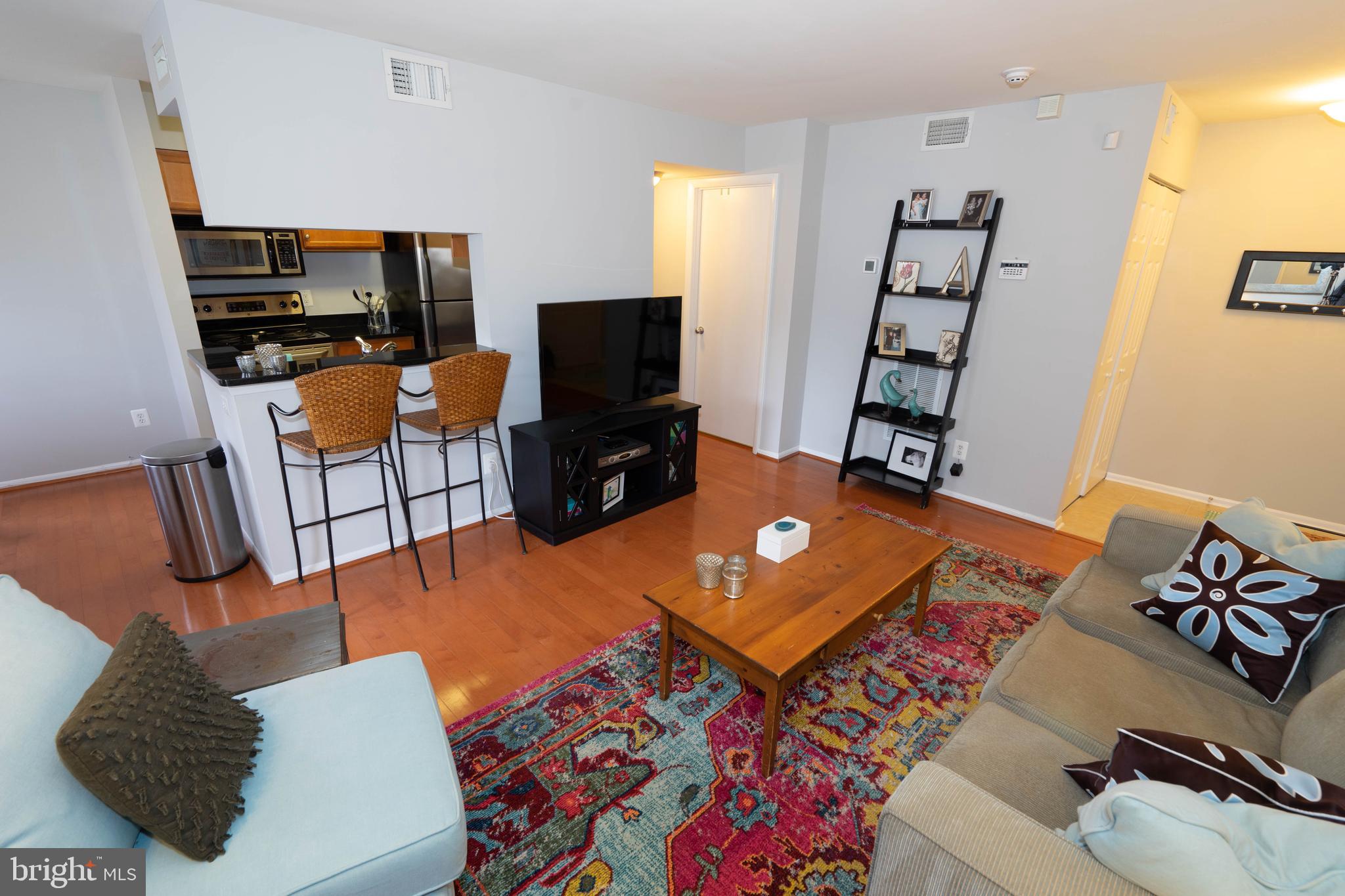 1711 Ascot Way, Unit C Reston, VA 20190 - Photo 4 of 26 Living Room with Hardwood Floors