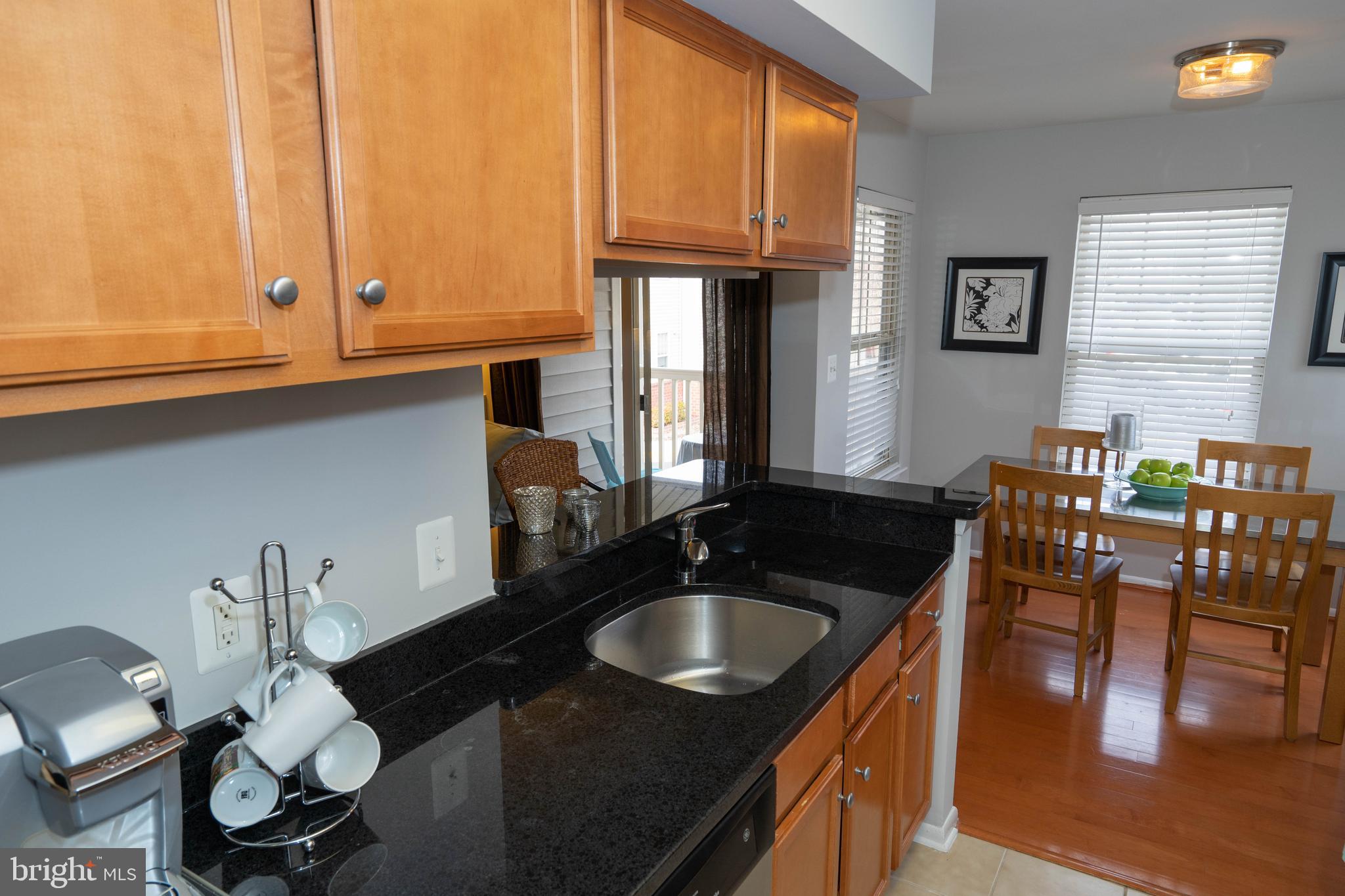 1711 Ascot Way, Unit C Reston, VA 20190 - Photo 7 of 26 Kitchen with Granite Opening to Dining Area