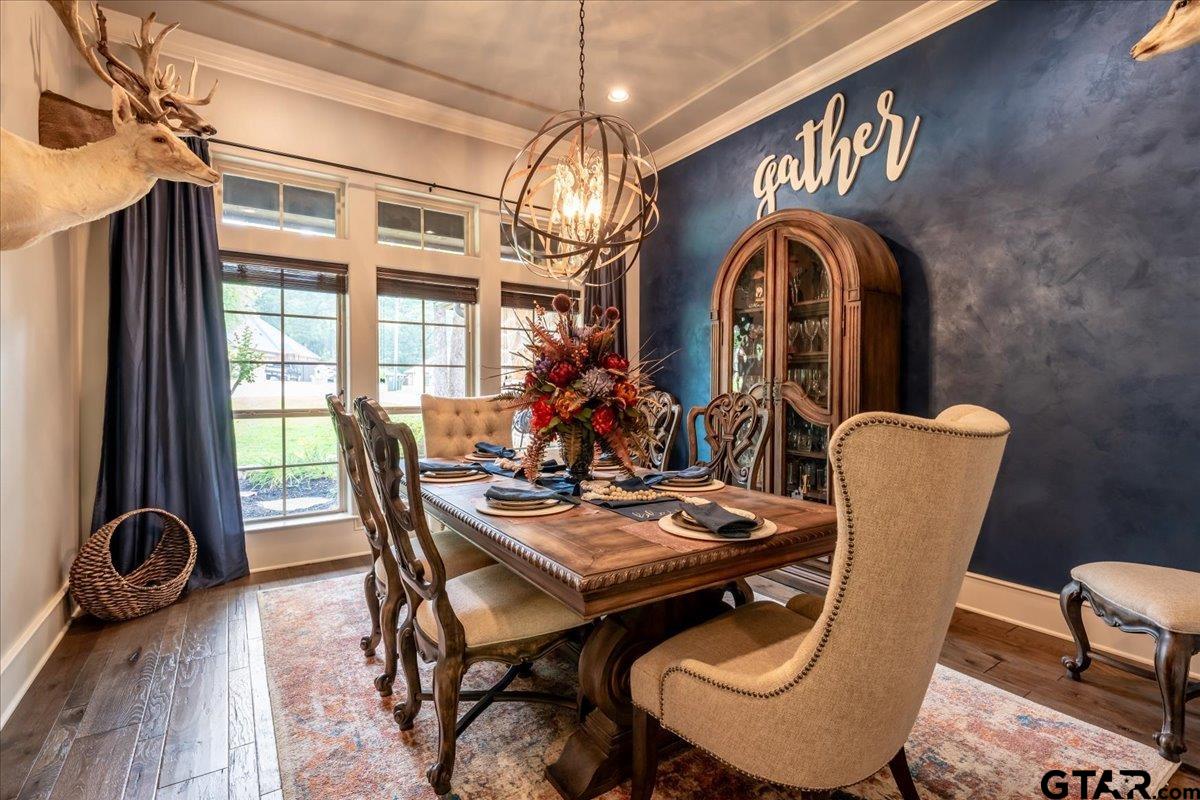 6527 Rochester Way Tyler, TX 75703 - Photo 16 of 48 a view of a dining room with furniture and chandelier