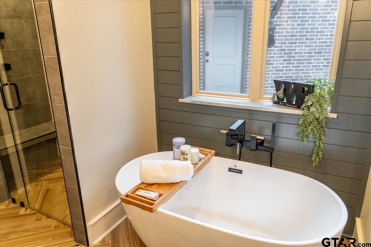 6527 Rochester Way Tyler, TX 75703 - Photo 19 of 48 a bathroom with a sink and a mirror