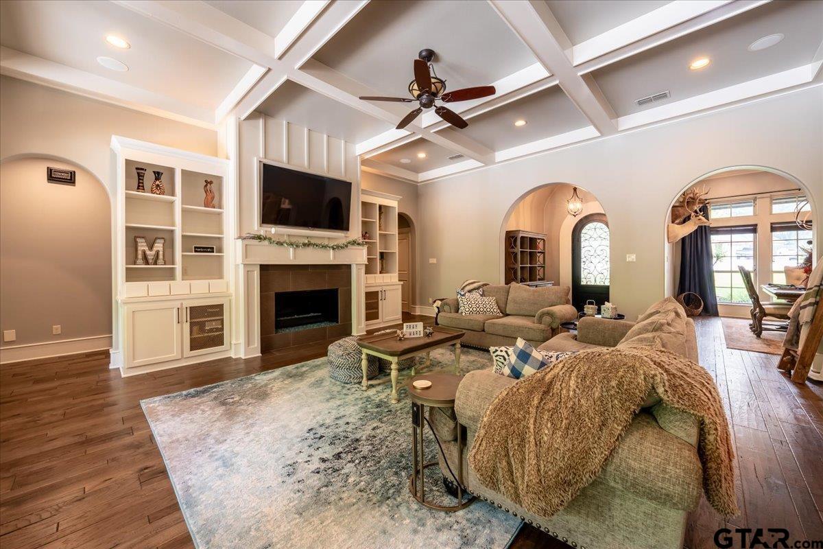 6527 Rochester Way Tyler, TX 75703 - Photo 3 of 48 a living room with fireplace furniture and a flat screen tv