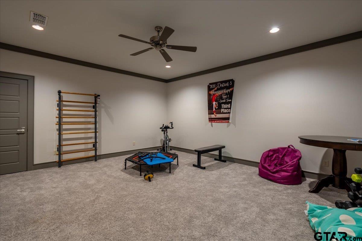 6527 Rochester Way Tyler, TX 75703 - Photo 31 of 48 a living room with furniture and a ceiling fan