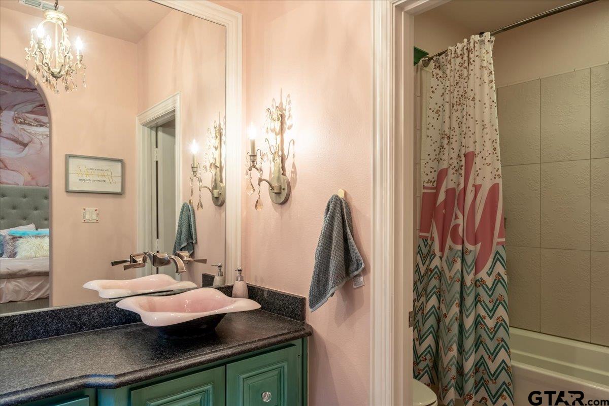 6527 Rochester Way Tyler, TX 75703 - Photo 34 of 48 a bathroom with a sink and a mirror