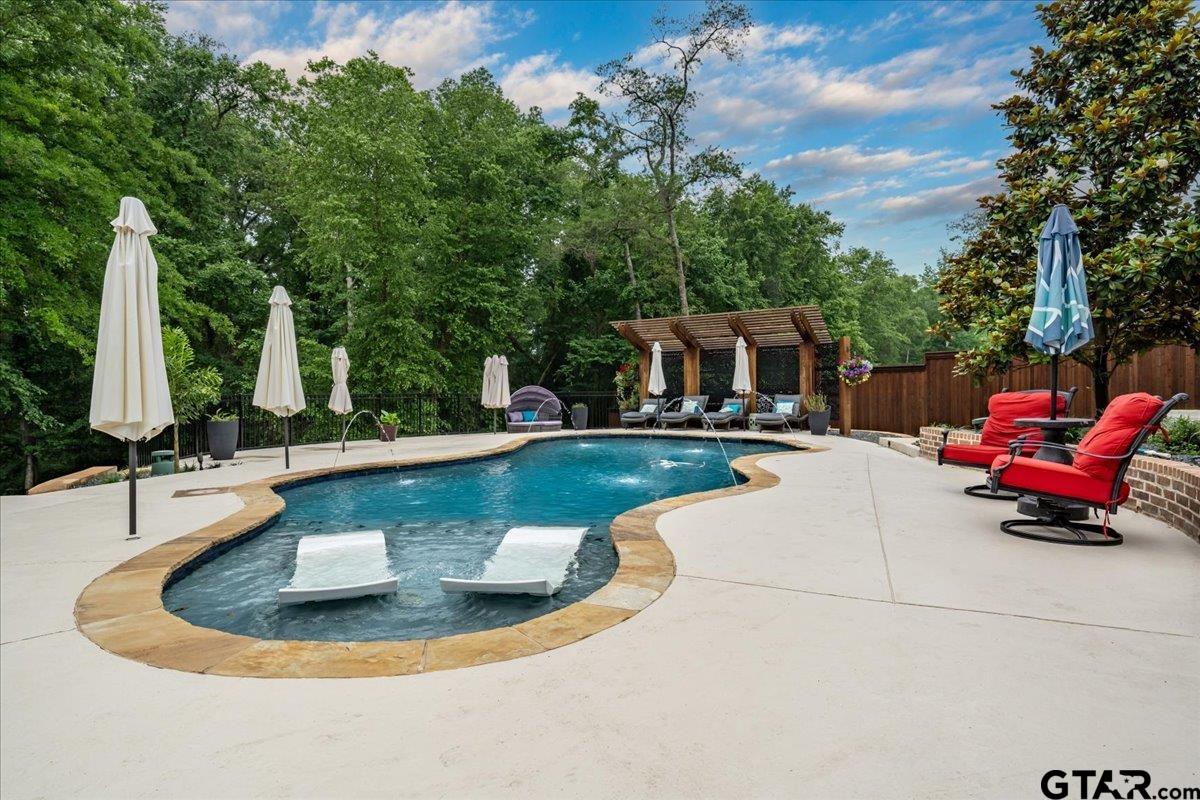 6527 Rochester Way Tyler, TX 75703 - Photo 44 of 48 a view of a swimming pool with outdoor seating