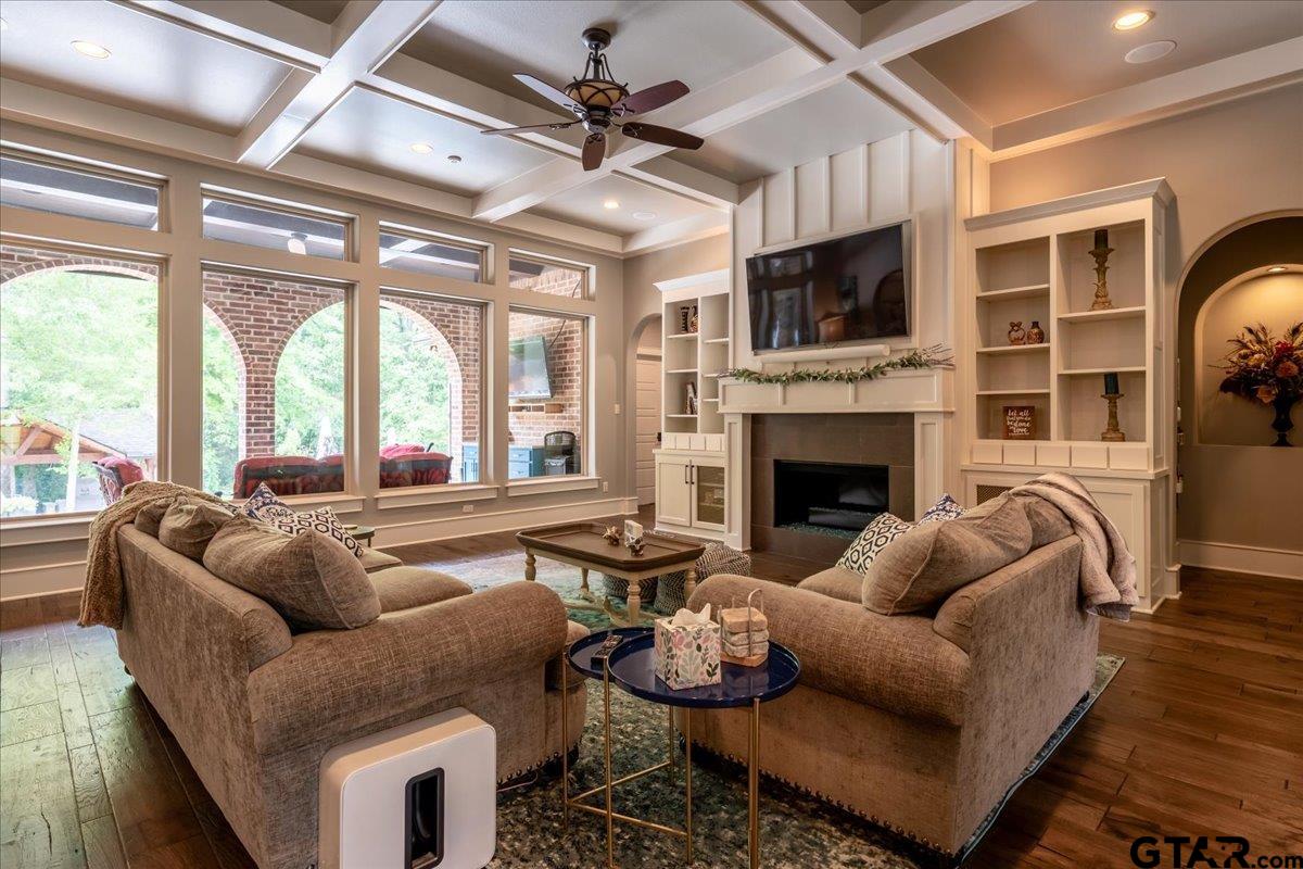 6527 Rochester Way Tyler, TX 75703 - Photo 7 of 48 a living room with furniture a flat screen tv and a fireplace