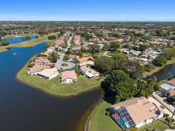 a living room with furniture stairs and a view of a living room