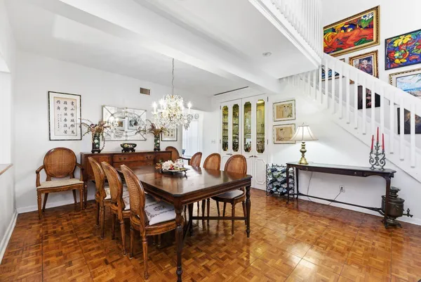 a view of a dining room with furniture window and outside view