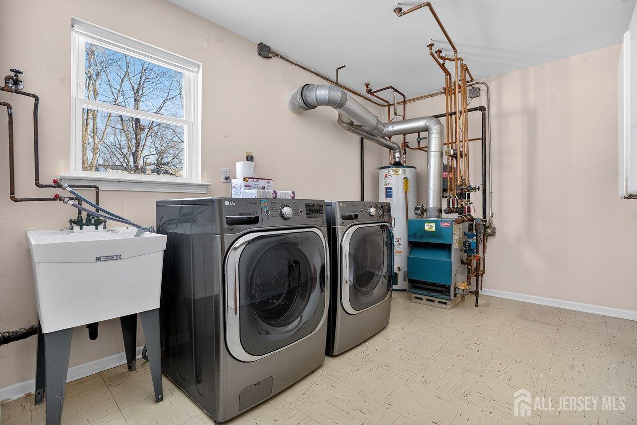1 Wakefield Drive Edison, NJ 08820 - Photo 26 of 29 a utility room with dryer and washer
