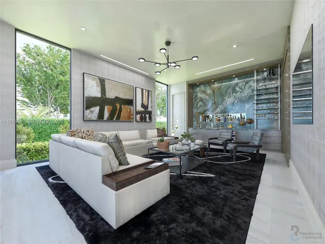 a living room with couch a large window and a fireplace