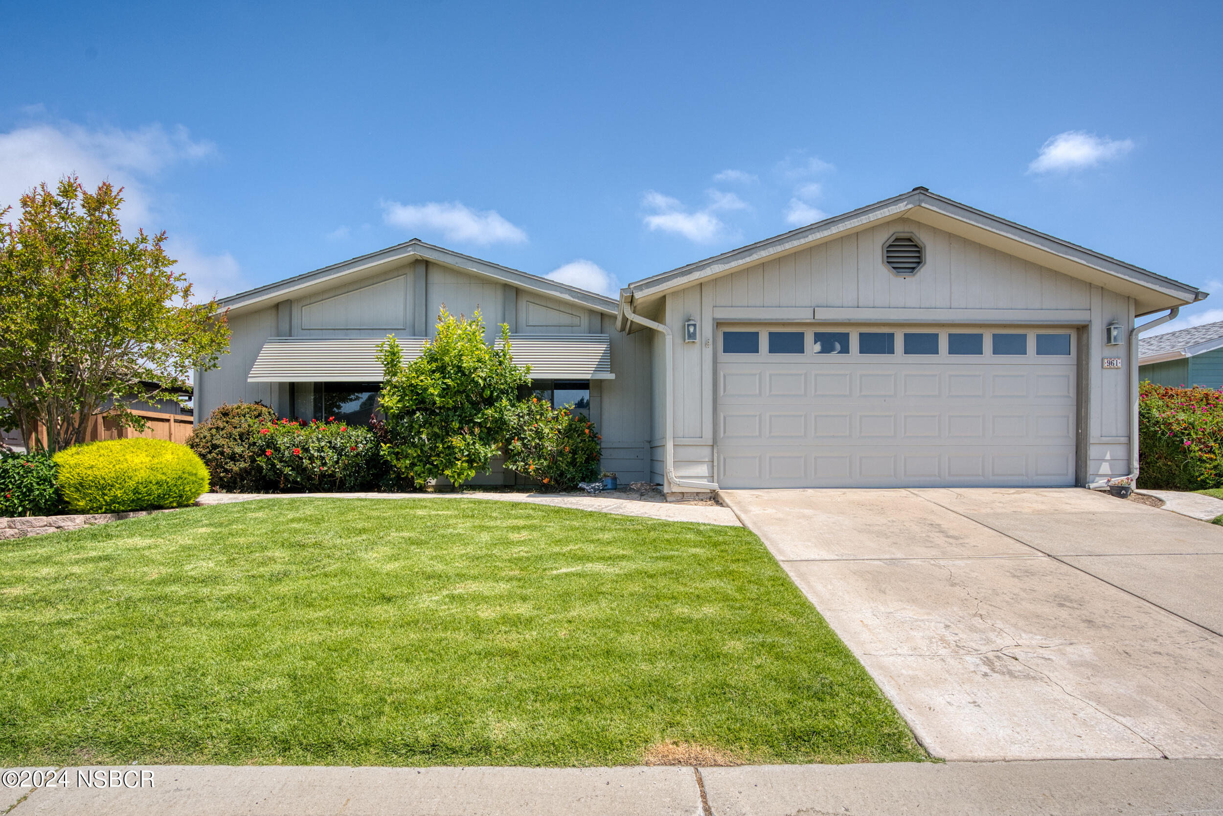 961 North Ridge View Drive Santa Maria, CA 93455 - Photo 1 of 37 a front view of house with yard and green space