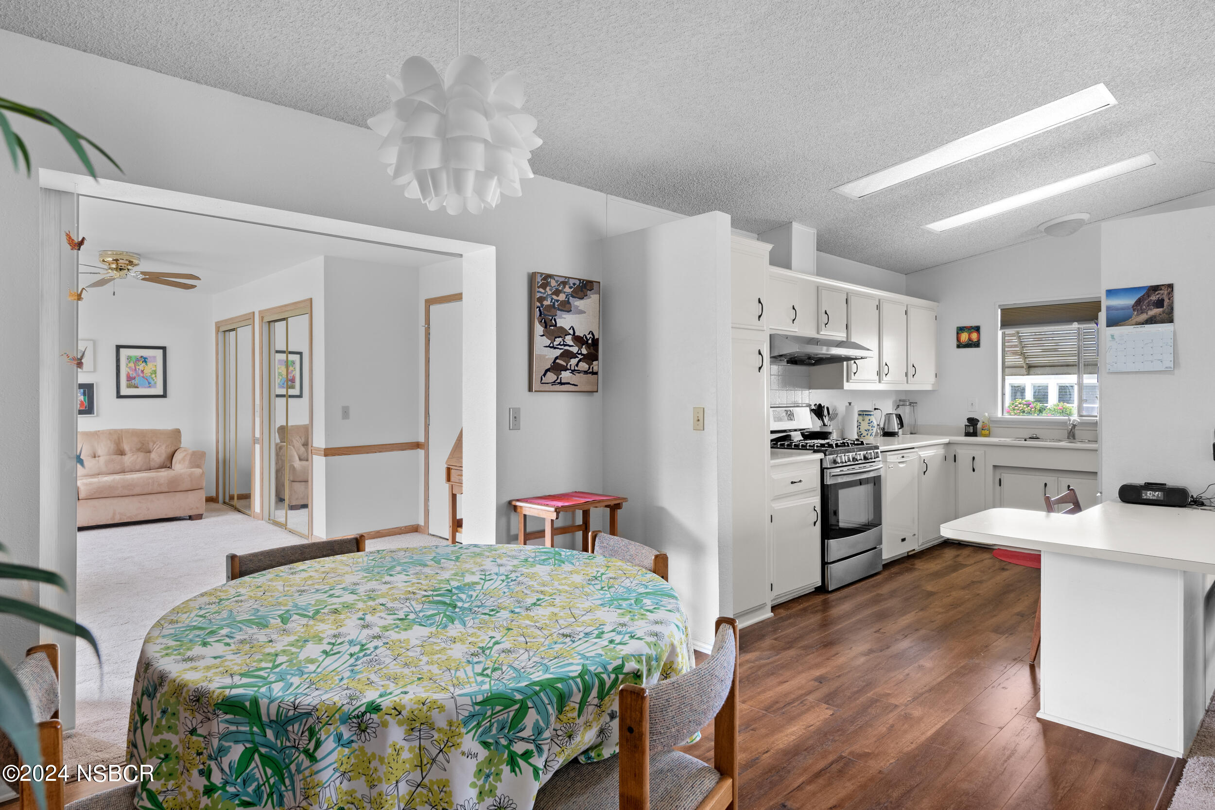 961 North Ridge View Drive Santa Maria, CA 93455 - Photo 15 of 37 a kitchen with white cabinets and refrigerator