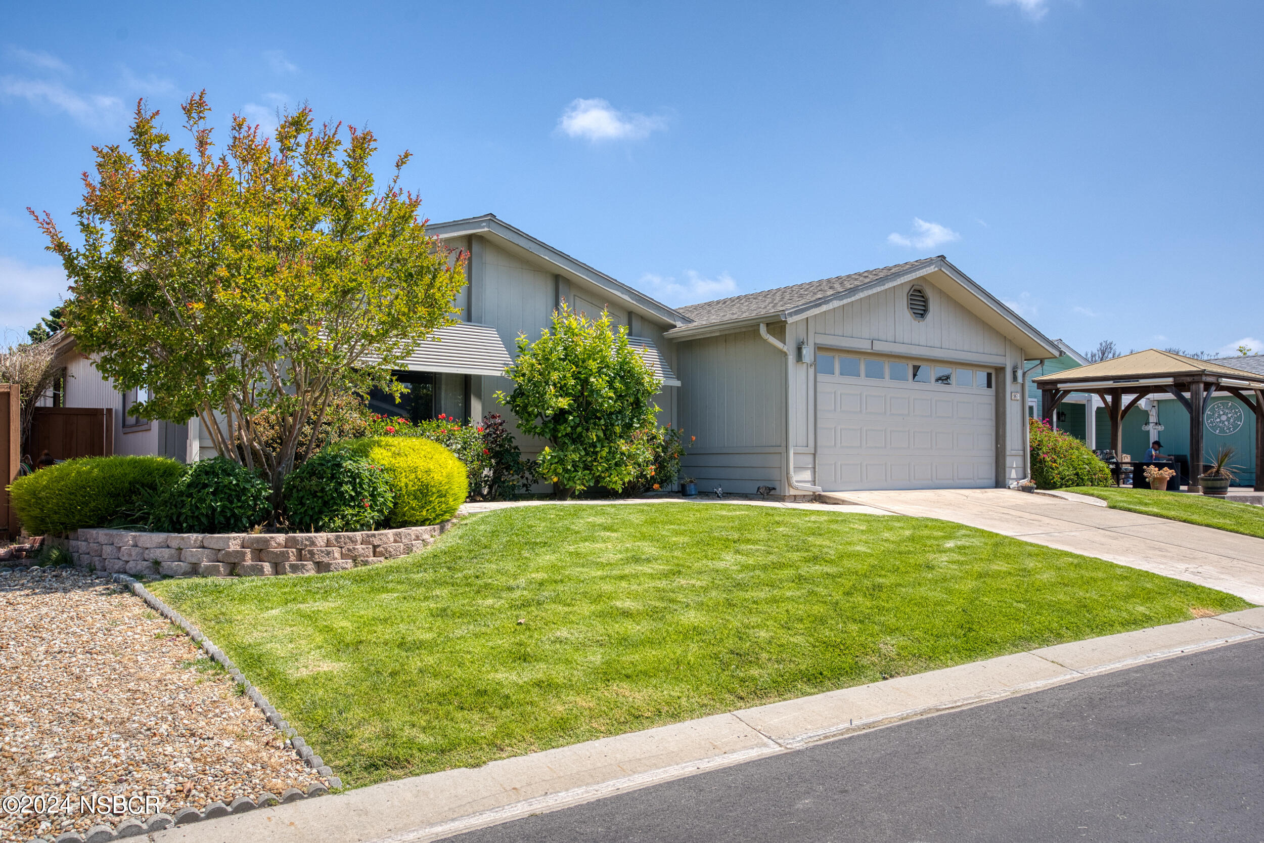 961 North Ridge View Drive Santa Maria, CA 93455 - Photo 2 of 37 a front view of a house with a yard