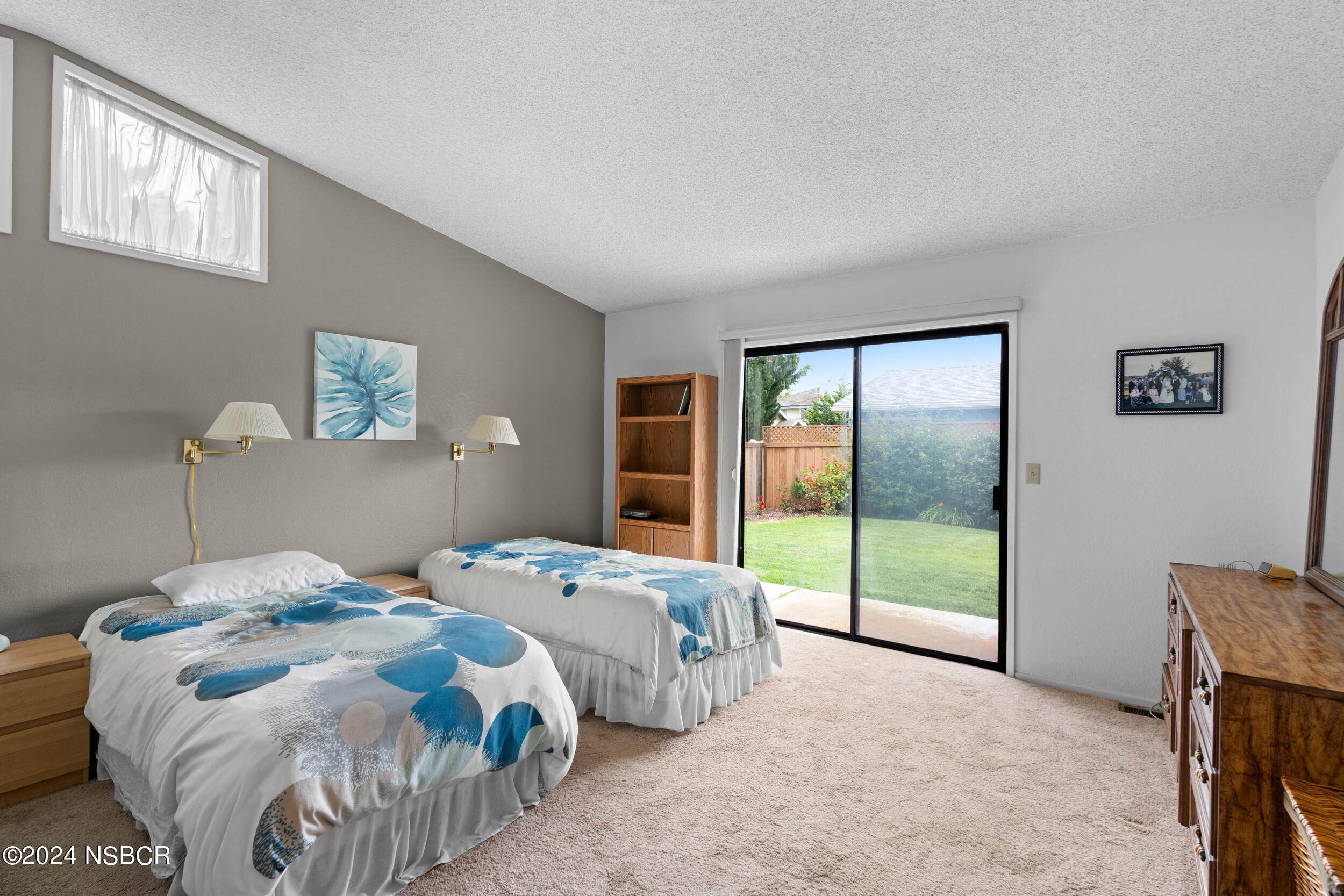 961 North Ridge View Drive Santa Maria, CA 93455 - Photo 23 of 37 a bedroom with a bed and a dresser next to a window