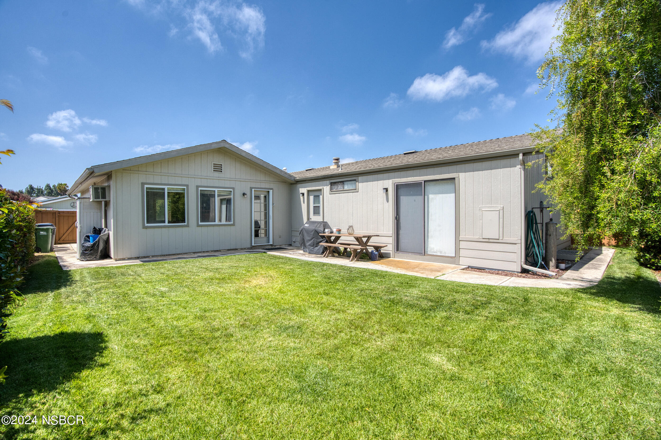 961 North Ridge View Drive Santa Maria, CA 93455 - Photo 31 of 37 a front view of a house with a garden and yard