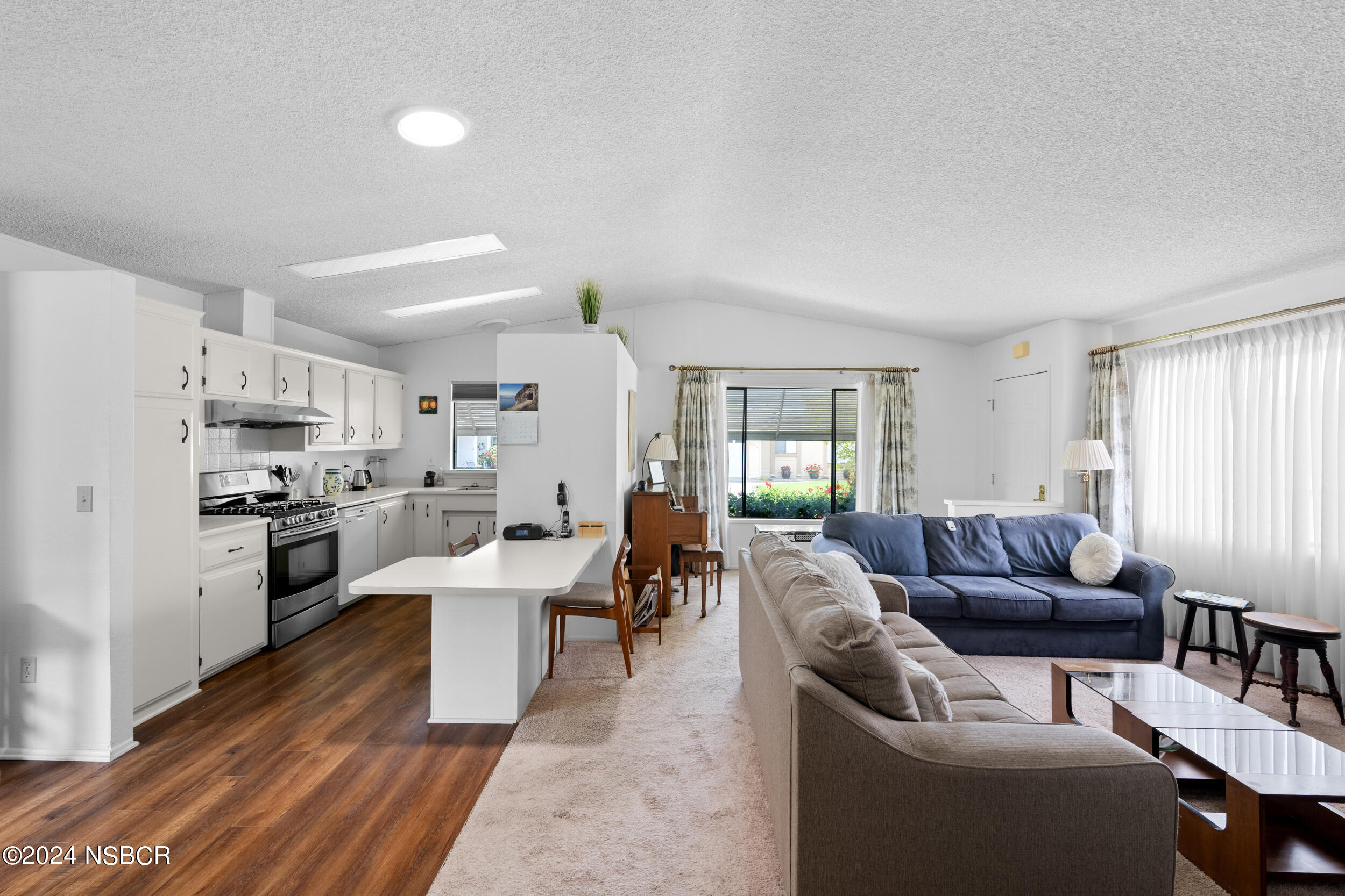 961 North Ridge View Drive Santa Maria, CA 93455 - Photo 4 of 37 a living room with stainless steel appliances furniture and a kitchen view