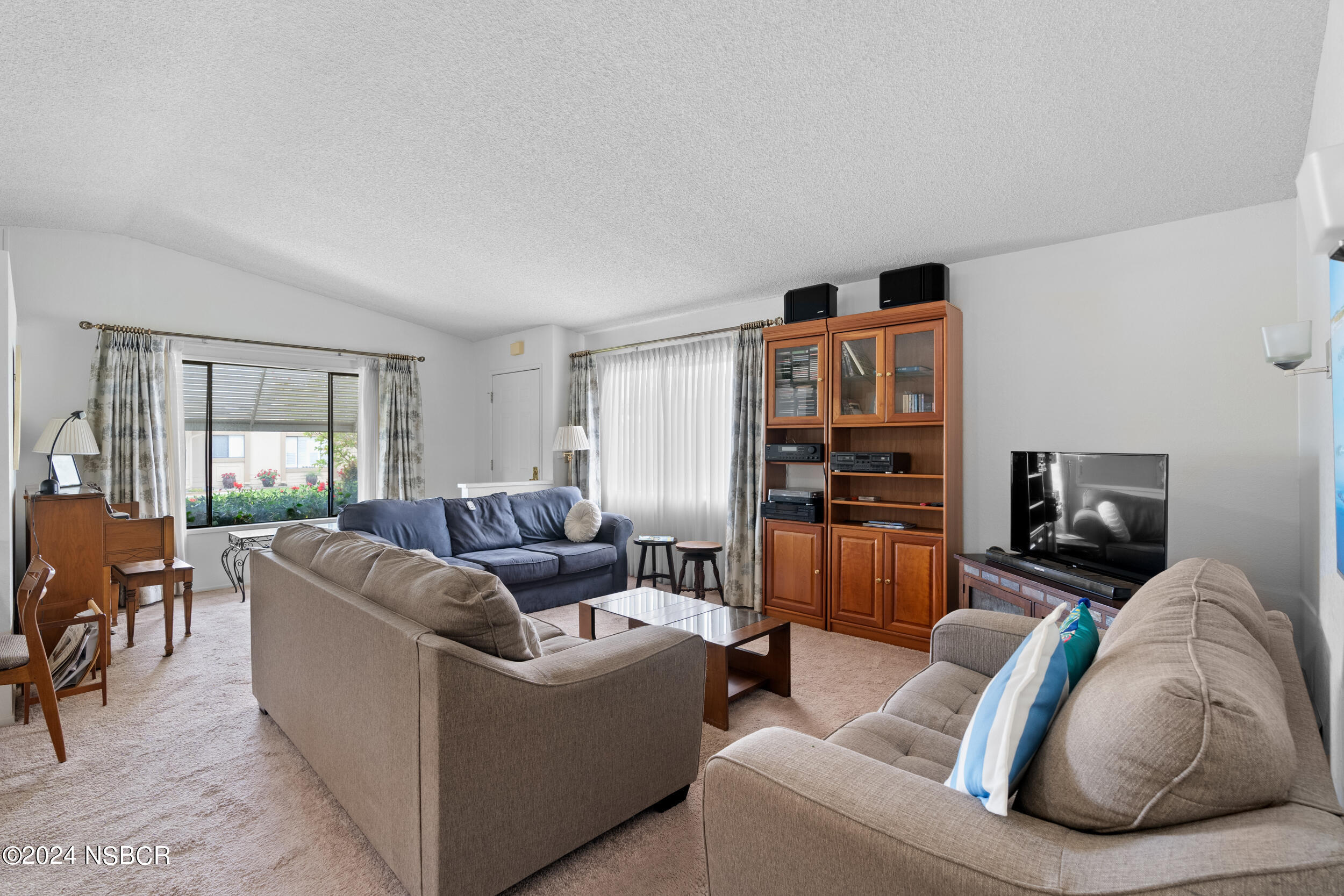 961 North Ridge View Drive Santa Maria, CA 93455 - Photo 5 of 37 a living room with furniture and a flat screen tv