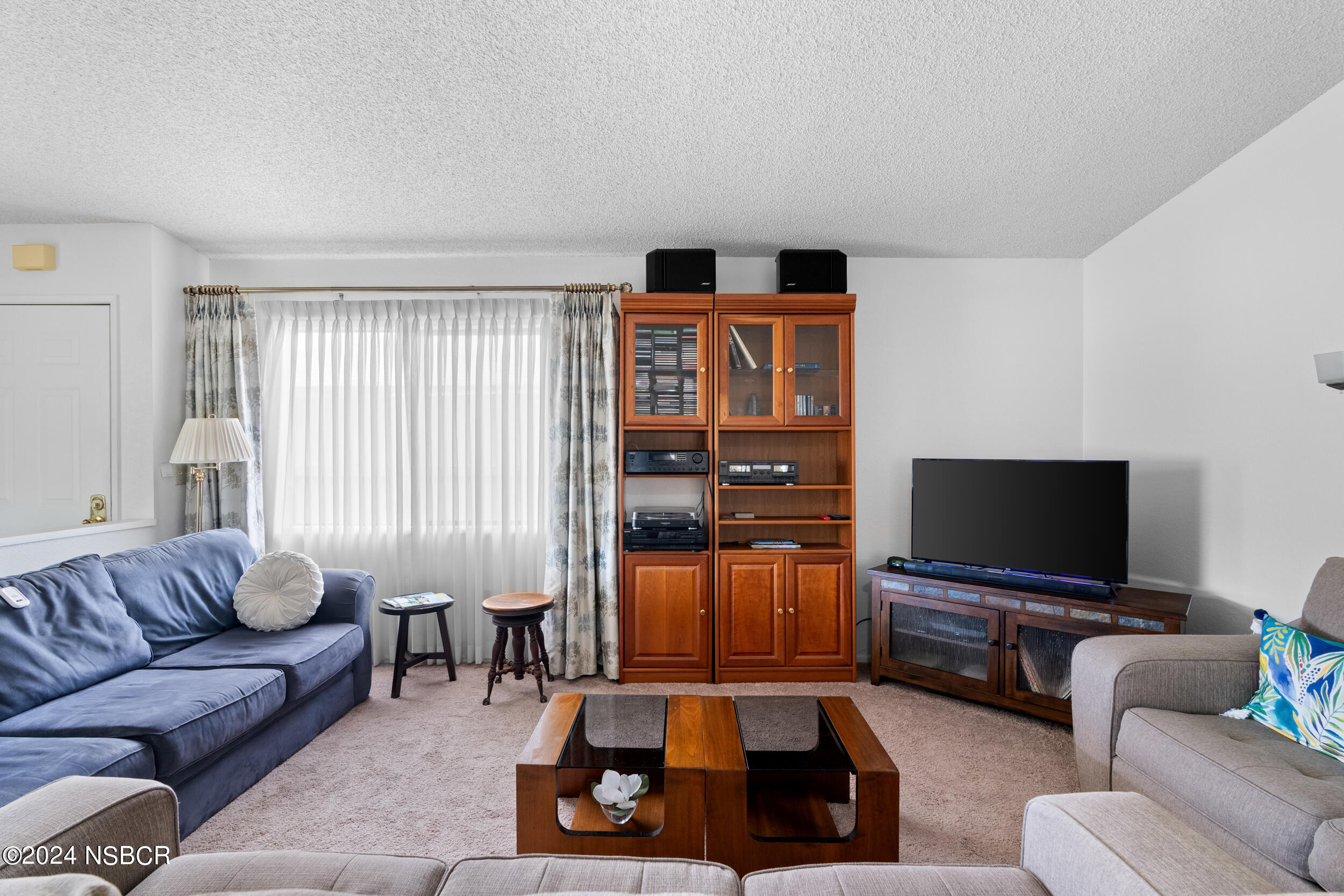 961 North Ridge View Drive Santa Maria, CA 93455 - Photo 6 of 37 a living room with furniture and a flat screen tv