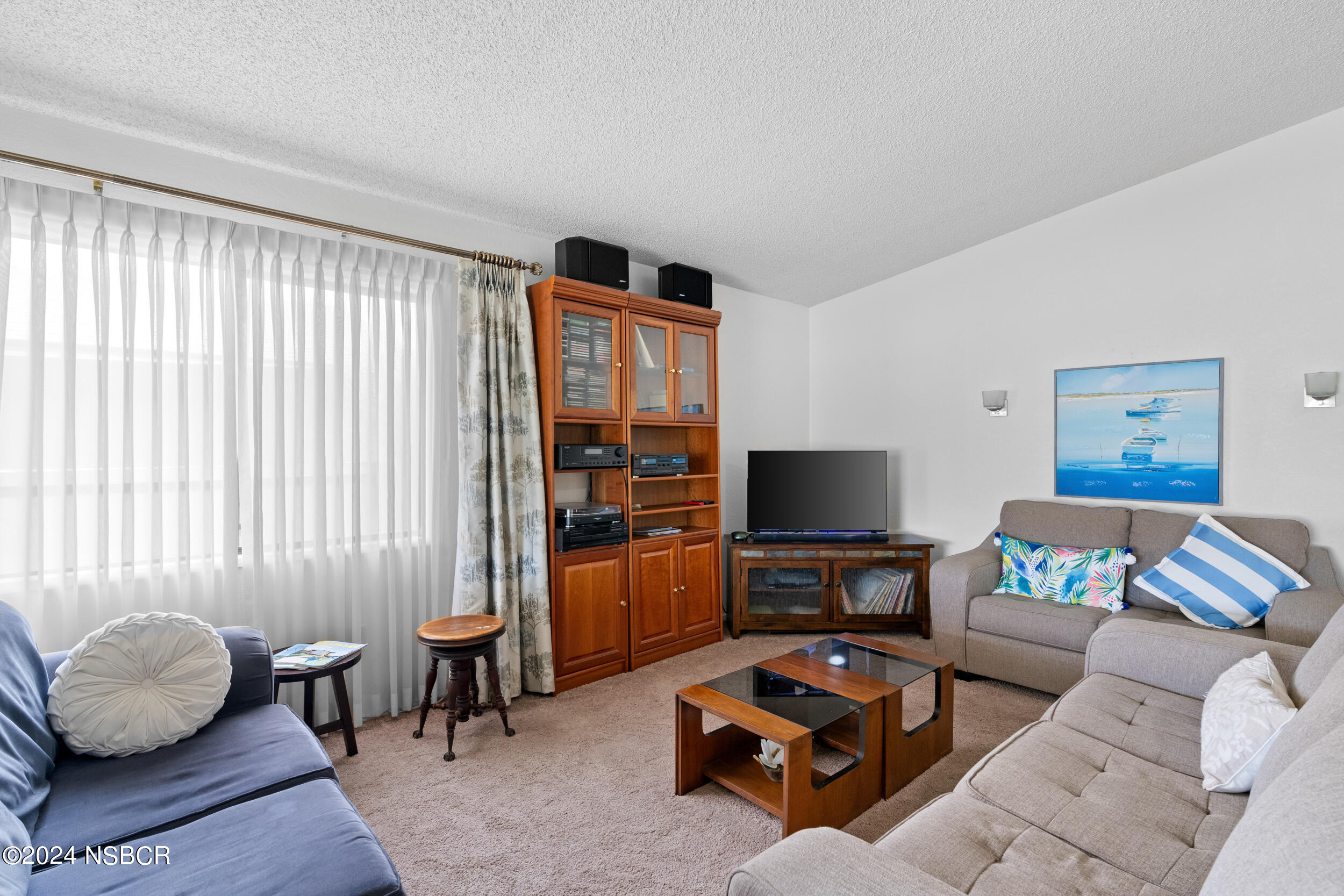 961 North Ridge View Drive Santa Maria, CA 93455 - Photo 9 of 37 a living room with furniture and a flat screen tv