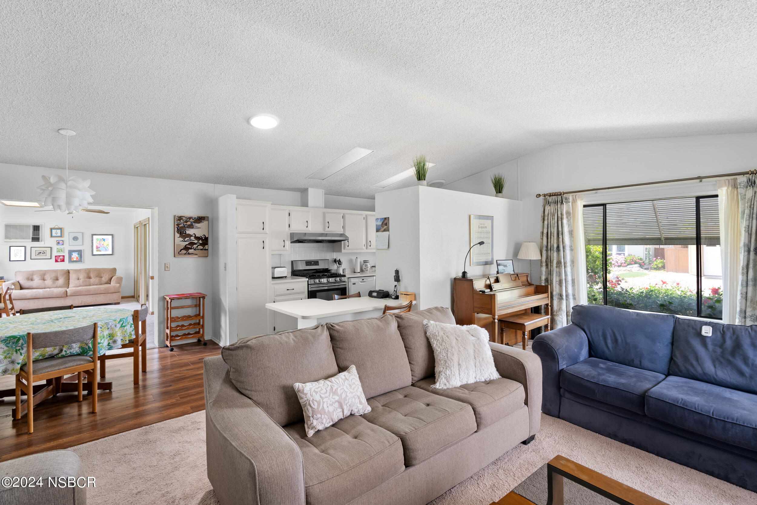 961 North Ridge View Drive Santa Maria, CA 93455 - Photo 10 of 37 a living room with furniture a kitchen view and a window