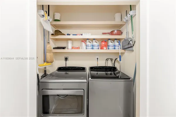 a utility room with washer and dryer