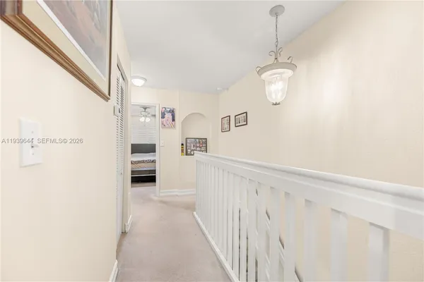 a view of a hallway with white walls