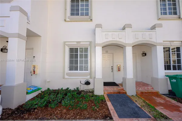 a view of entrance with house and wooden door