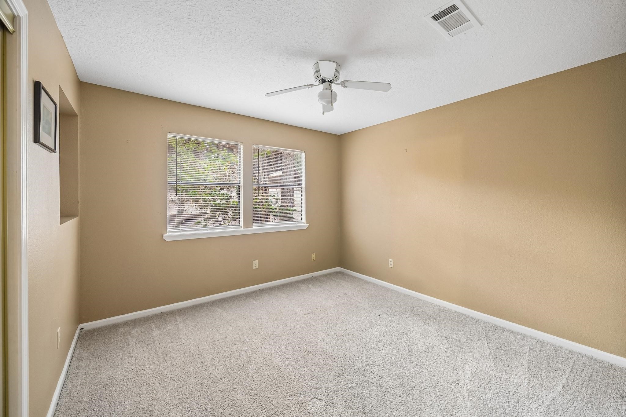 422 Nursery Road Spring, TX 77380 - Photo 9 of 16 Secondary bedroom upstairs.