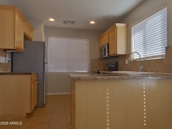 a view of a kitchen with a sink