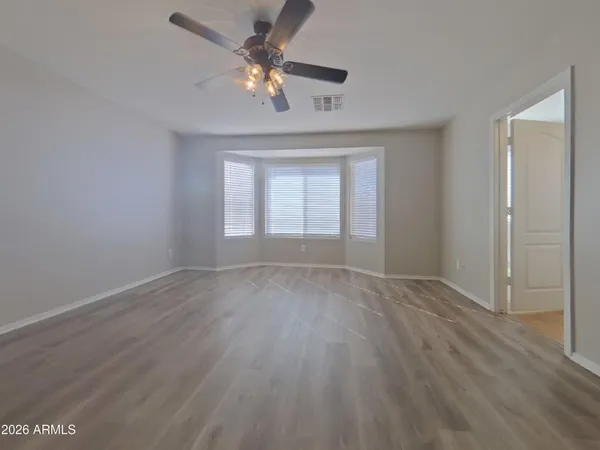 a kitchen with a sink a refrigerator and cabinets