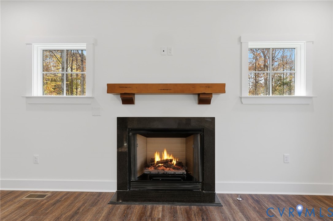 4062 Lake Killarney Road Gum Spring, VA 23065 - Photo 11 of 37 a living room with a fireplace and a fireplace