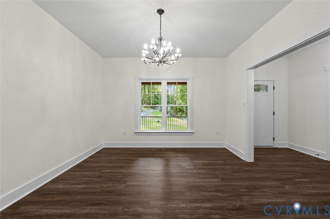 4062 Lake Killarney Road Gum Spring, VA 23065 - Photo 16 of 37 a view of empty room with wooden floor and fan