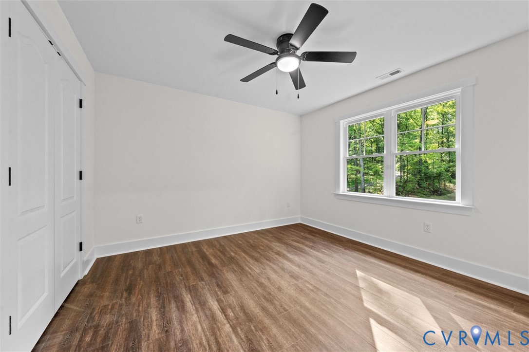 4062 Lake Killarney Road Gum Spring, VA 23065 - Photo 30 of 37 wooden floor in an empty room with a window