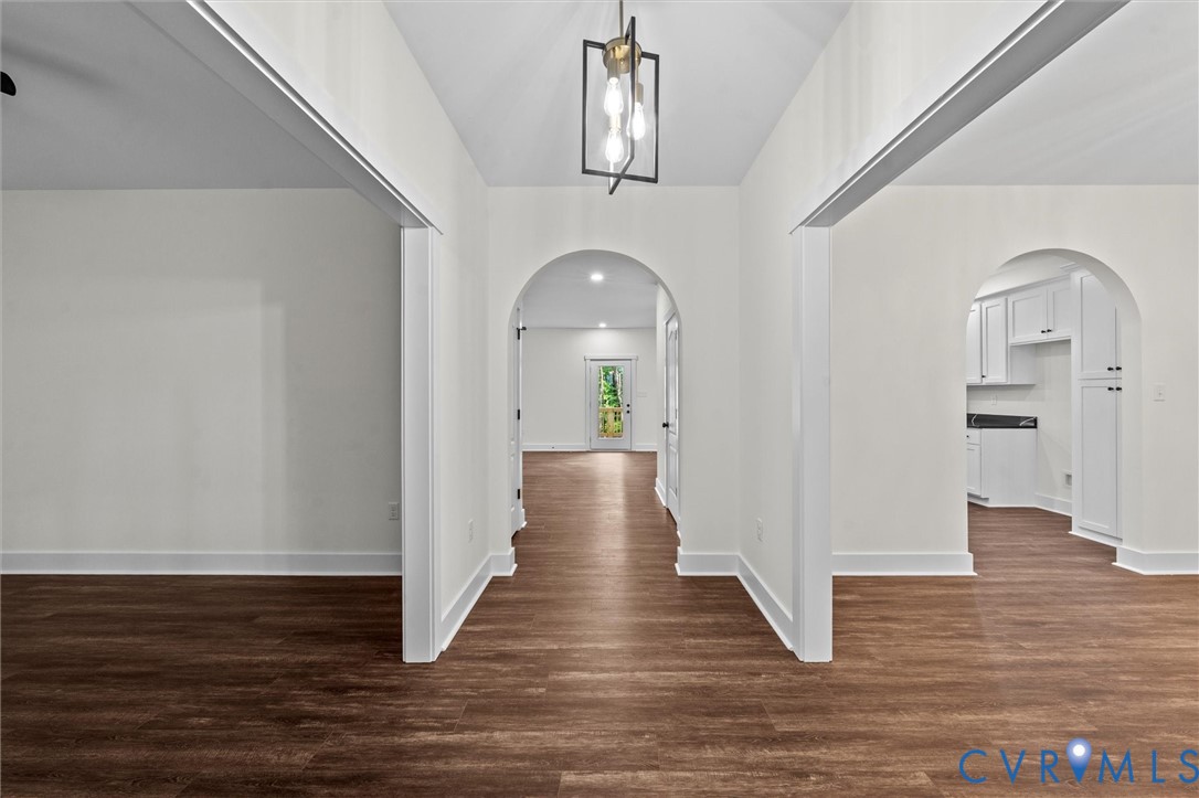 4062 Lake Killarney Road Gum Spring, VA 23065 - Photo 5 of 37 a view of a hallway with wooden floor and staircase