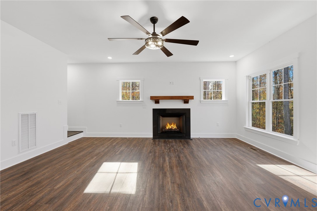 4062 Lake Killarney Road Gum Spring, VA 23065 - Photo 8 of 37 a view of empty room with wooden floor and fan